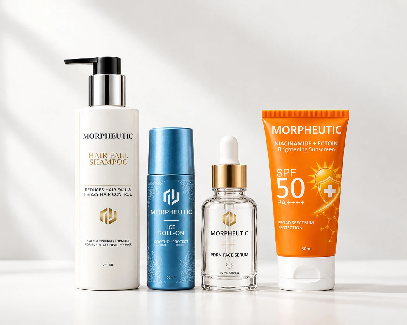 The Morpheutic collection — Hair Fall Shampoo, Ice Roll-On, PDRN Face Serum and Brightening Sunscreen — on a warm neutral surface